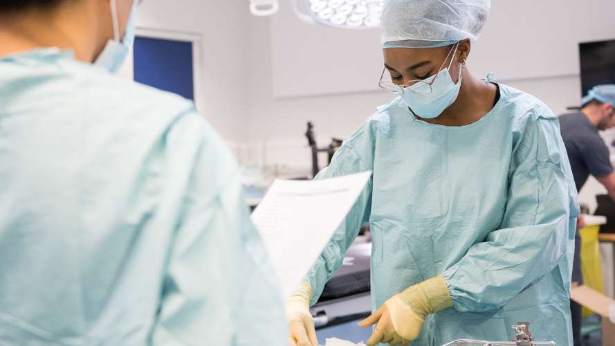 Students learning in an operating department