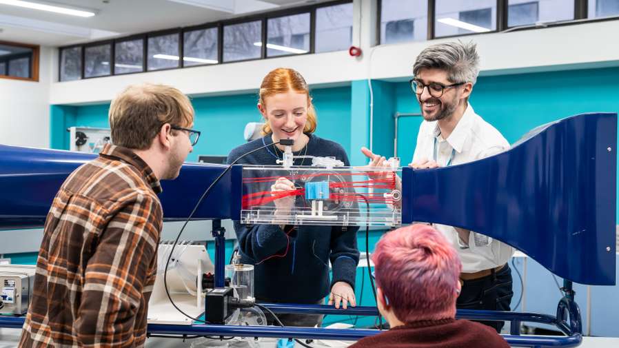 Engineering students using equipment in Productivity East