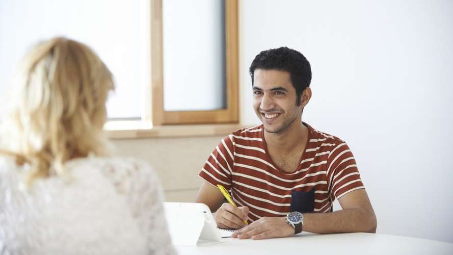 students smiling and taking note