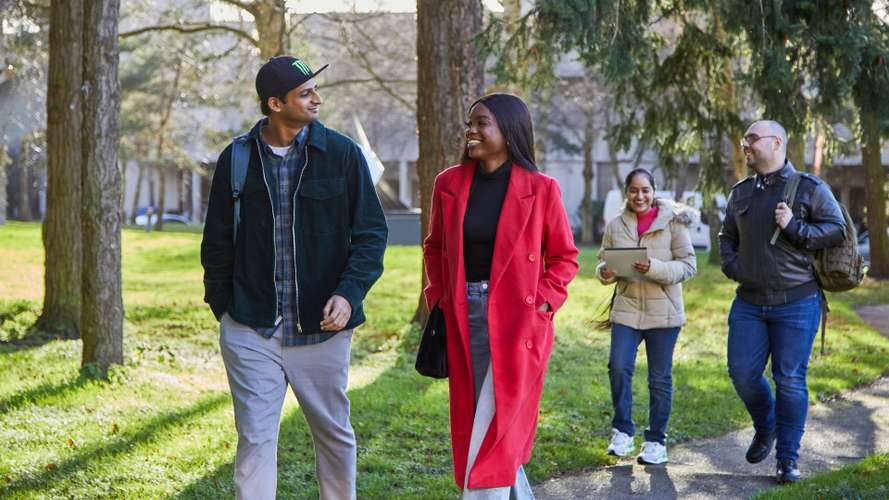 Students walking outside on campus