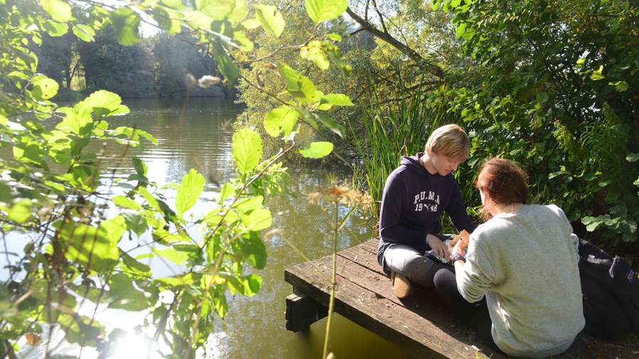 Students hanging out by the Broad