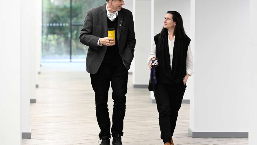 UEA staff members chatting during a break from work
