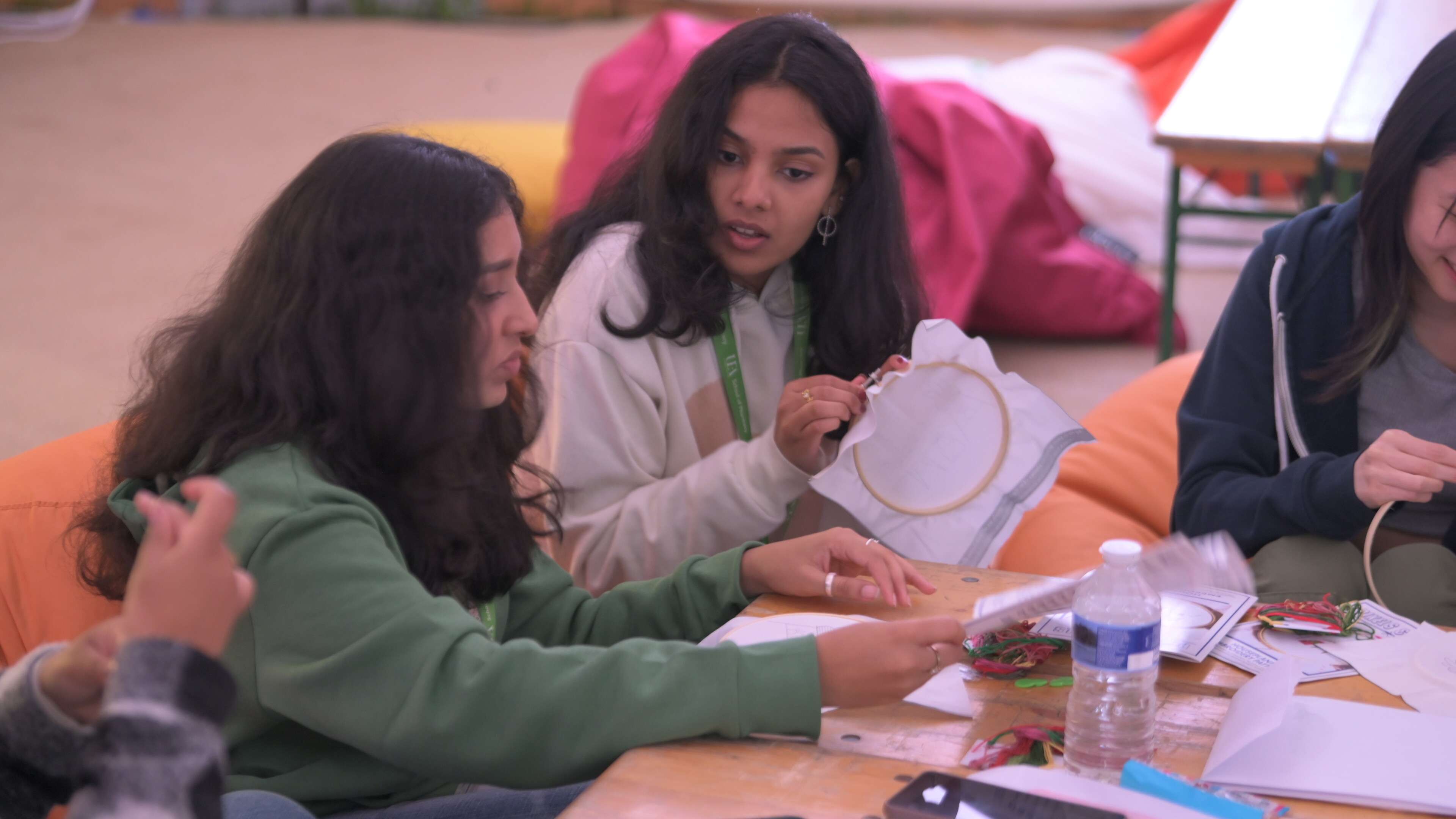Two students taking part in a crafting activity.