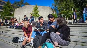 Students sitting in the Square