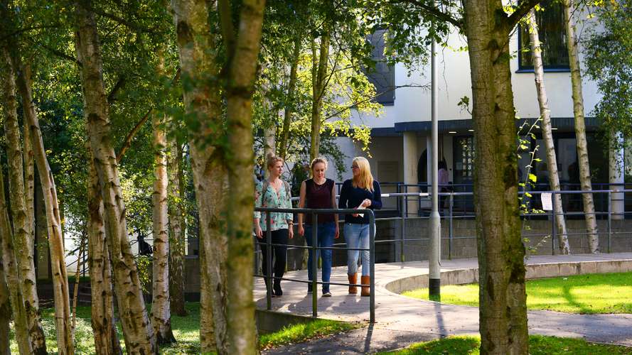 Students outside the Queens Building on UEA Campus