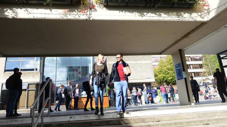 Students outside on campus, in the Square/Street