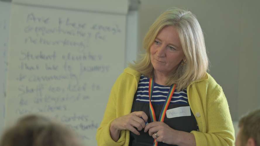 Teacher lecturing to students