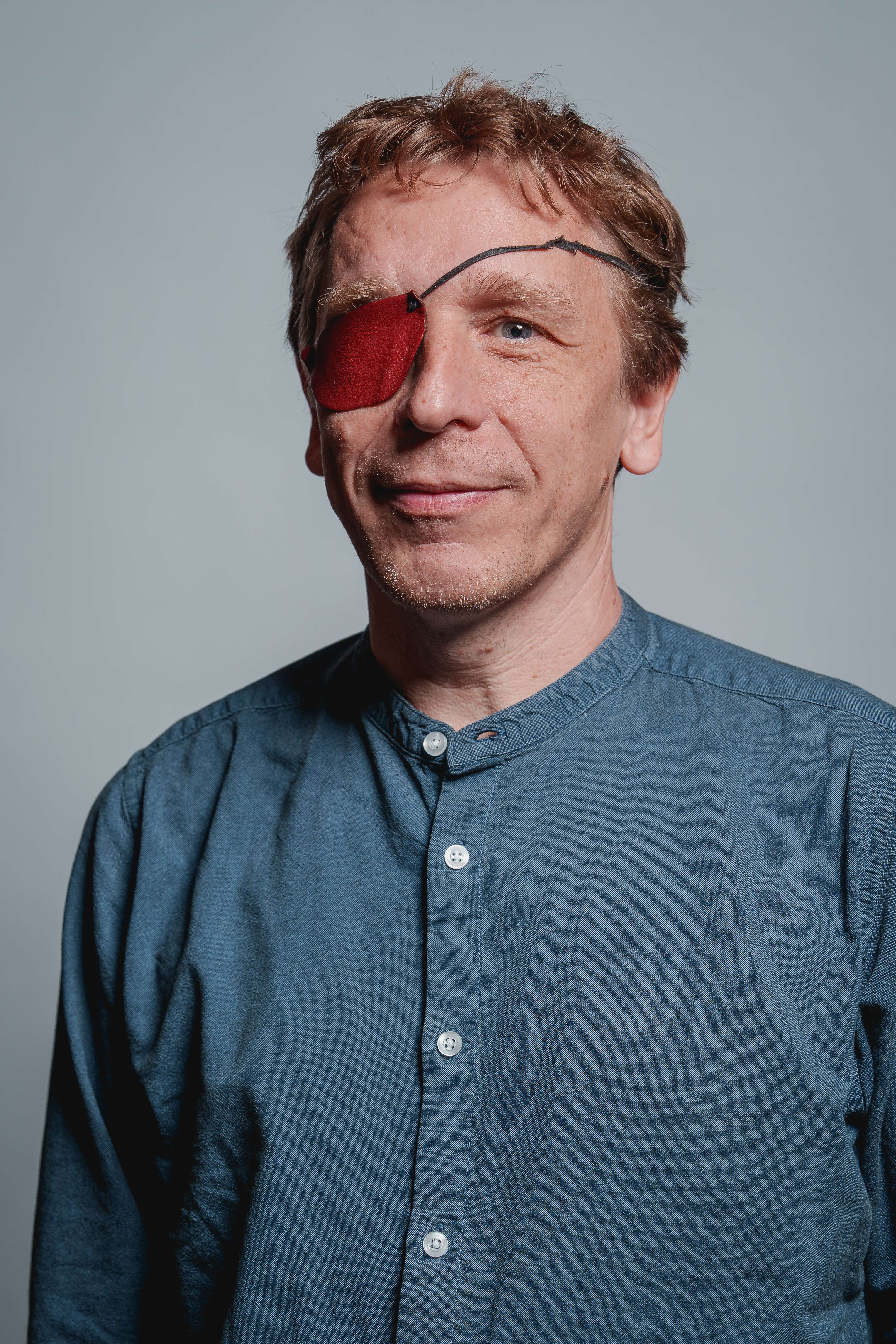 A portrait photo of someone smiling at the camera.