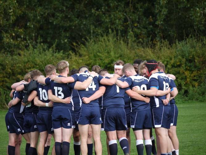 rugby team huddle - uea sport