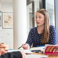 Concerned woman talking to another person
