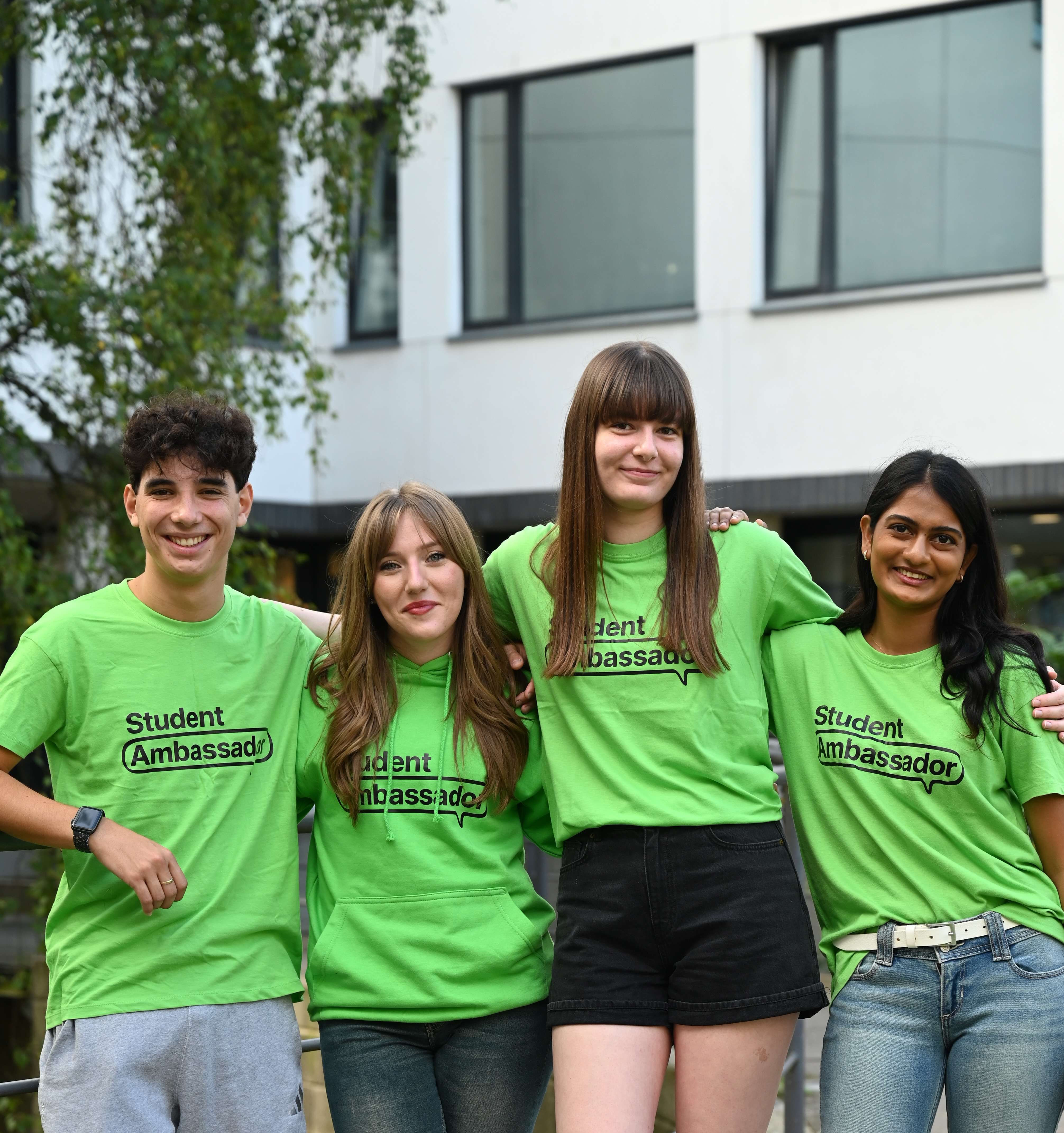 student ambassadors in green t-shirts