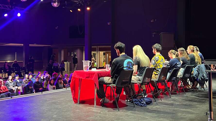 A panel of people on stage at the LCR.