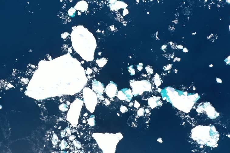 Scattered broken ice in the ocean.