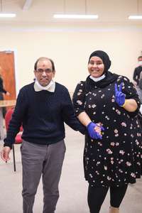 Two people posing for a photo at an event