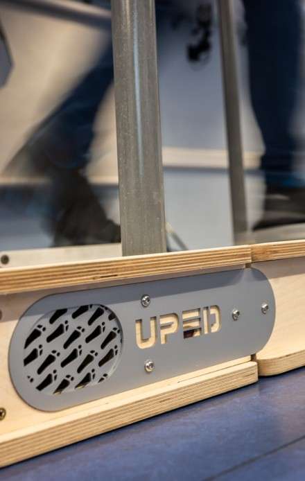 Rehabilitation equipment with a U-PED logo placard attached to it