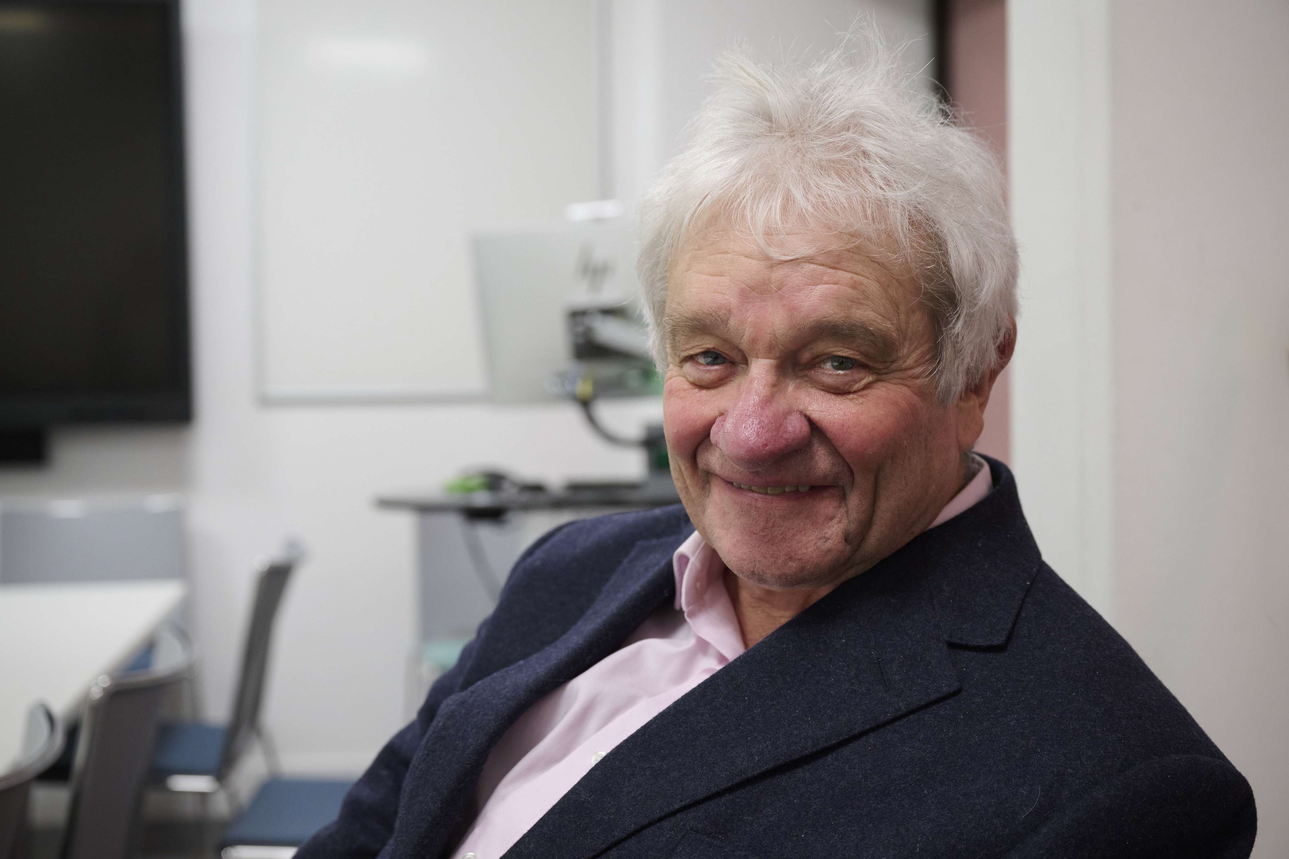 Sir Paul Nurse smiling into the camera