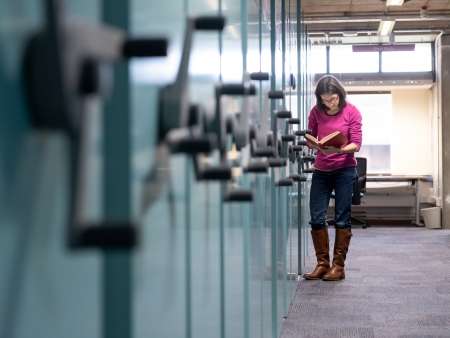 LDC-student-reading-book-in-archives-special-collections.jpg