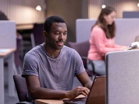 postgraduate-student-on-laptop-computer-smiling_timeline