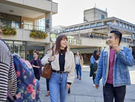 students-walking-through-campus-square-smiling_timeline
