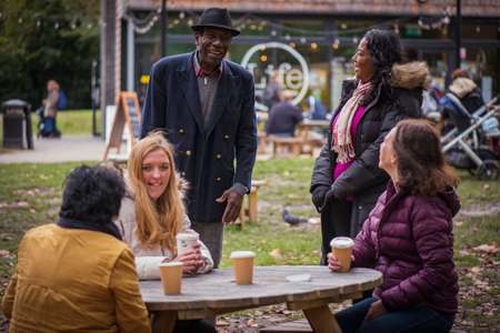 People enjoying a coffee and chat outside