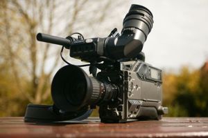 Videocamera sitting on a table outside