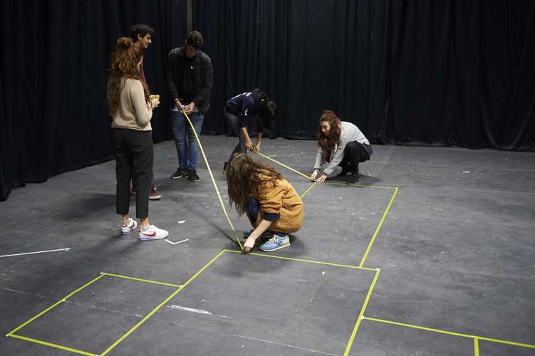 Drama students preparing the stage.