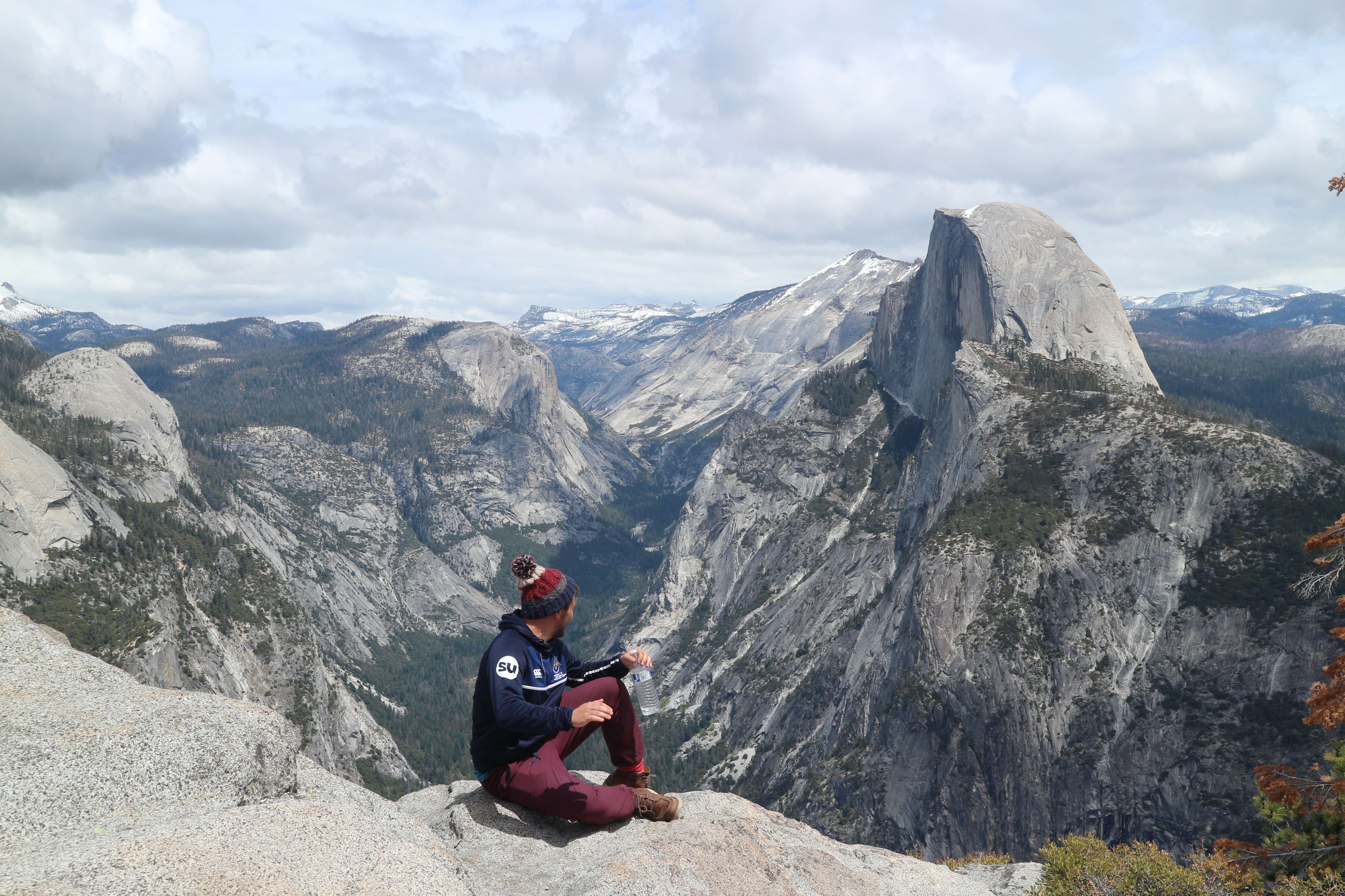 Student sat on a mountain