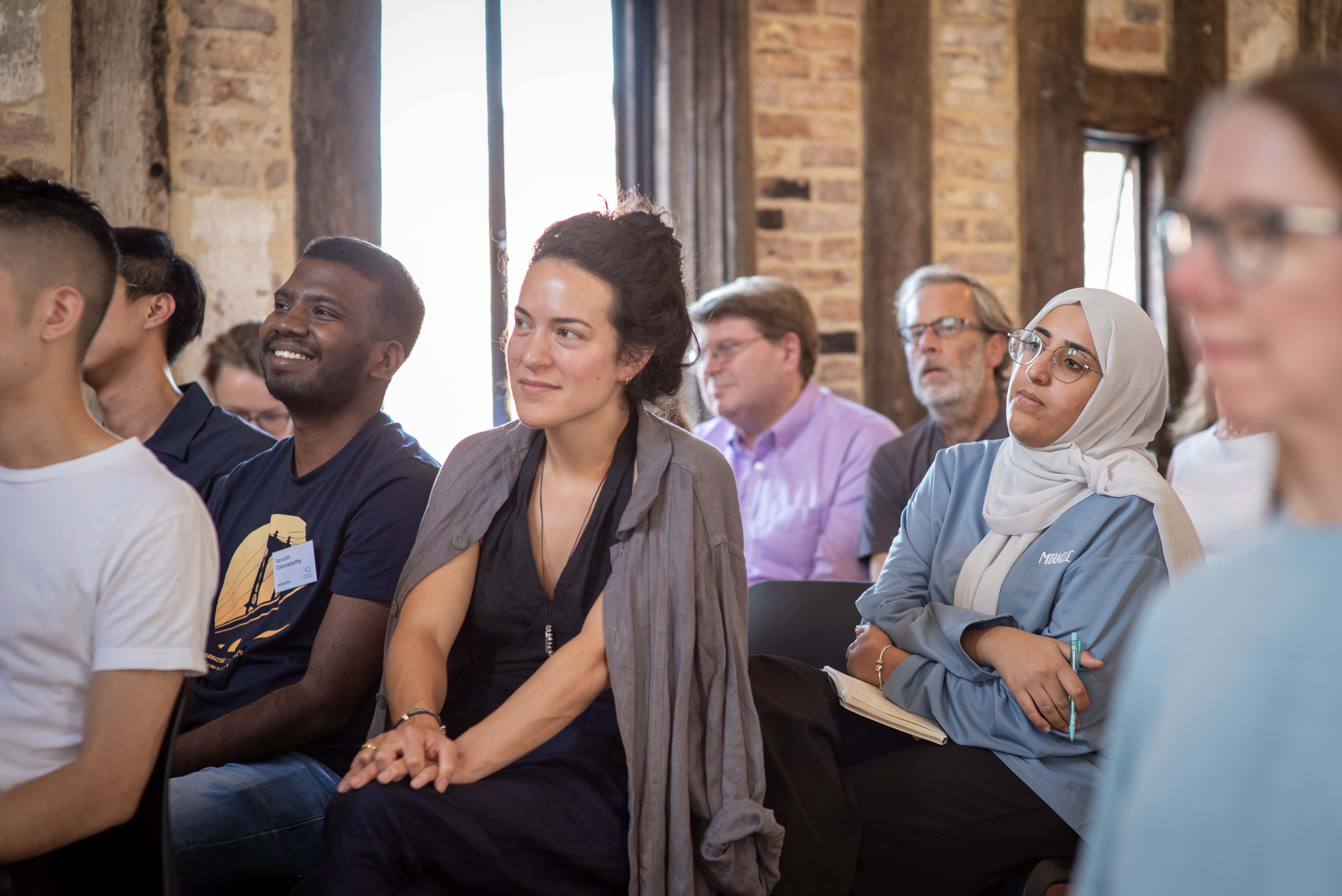 Photo of an audience watching a panel event