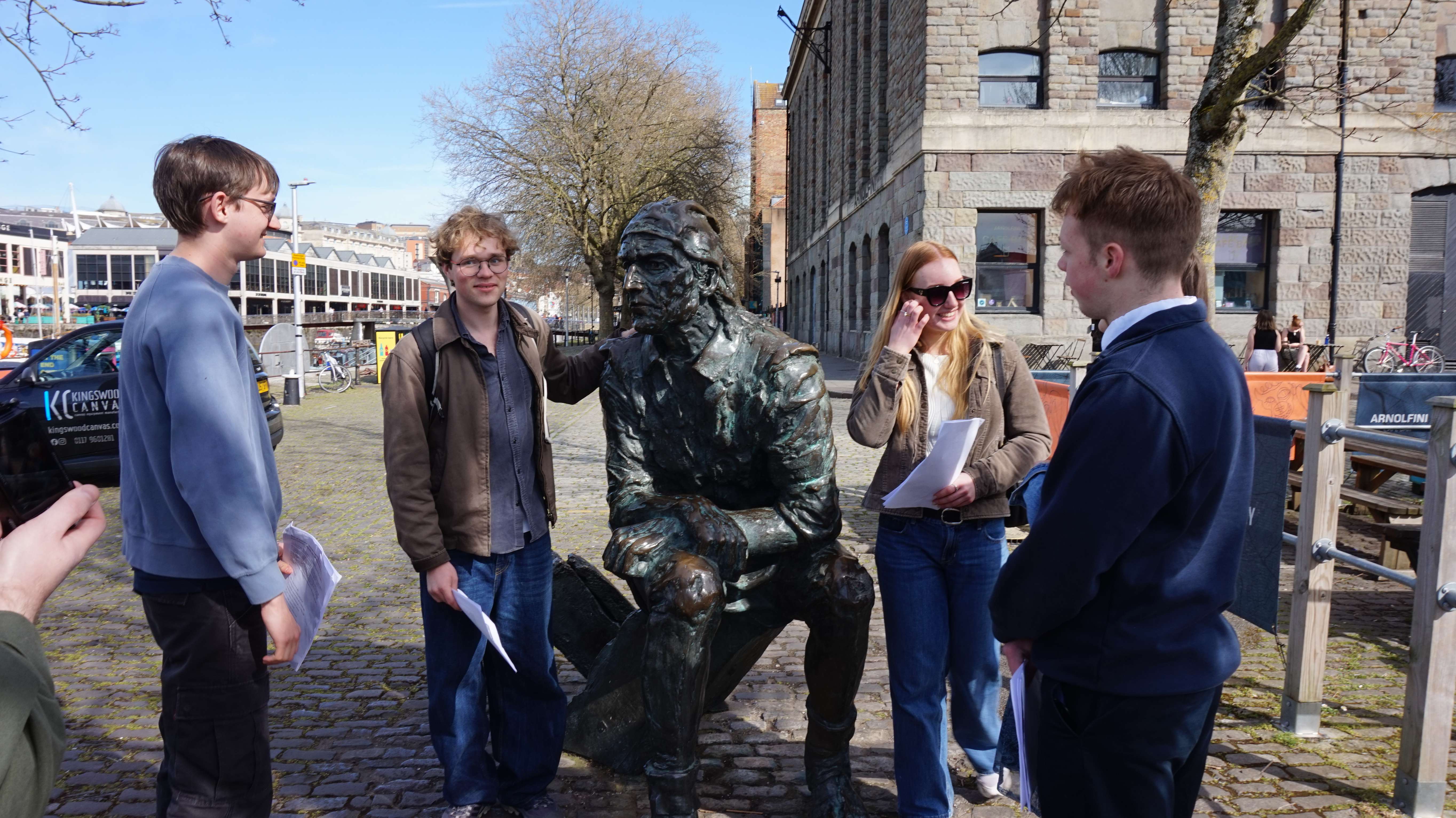 DEV students with statue of John Cabot in Bristol