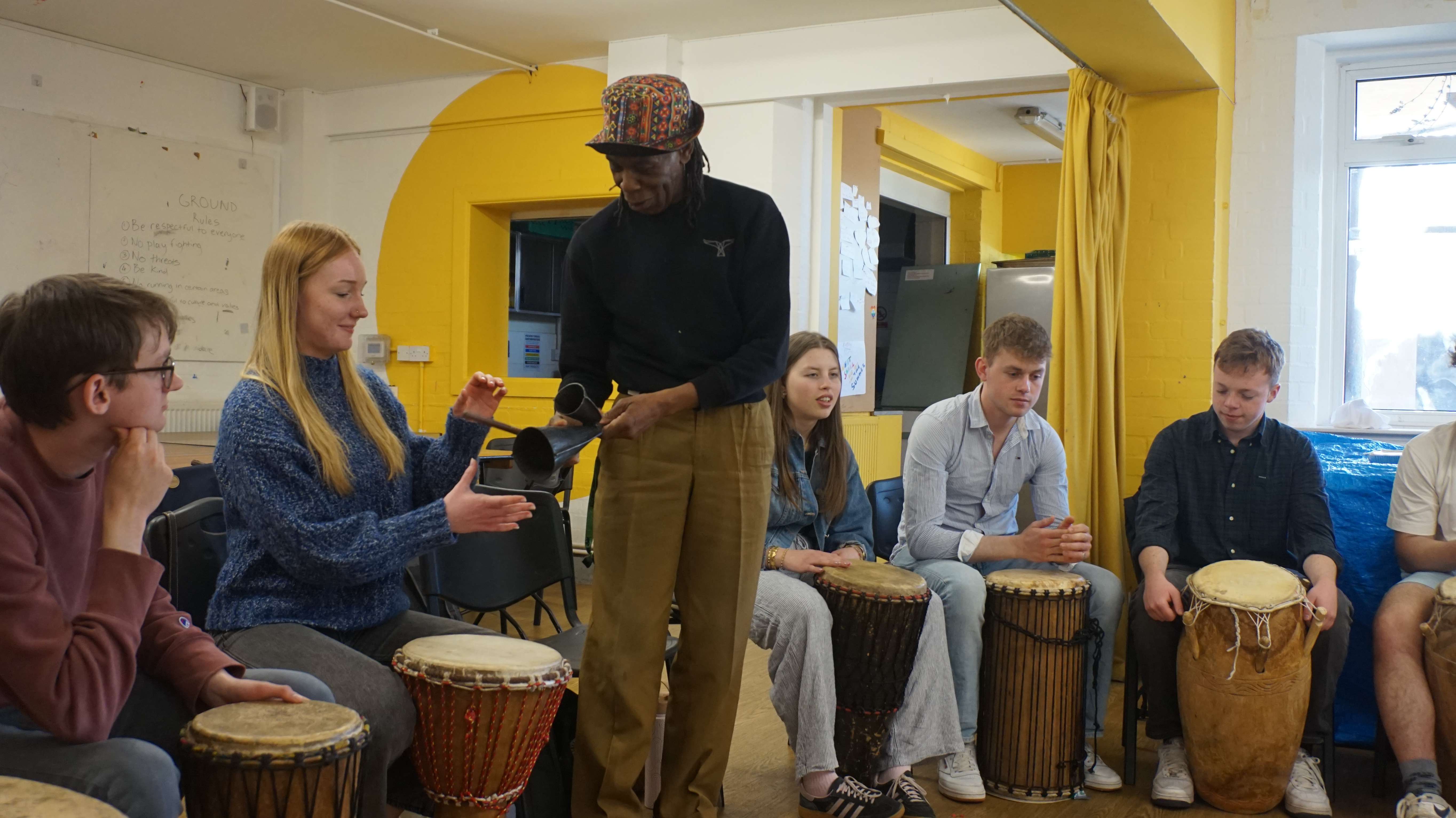 DEV students at a drumming workshop