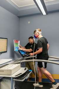 An individual running on a treadmill in the MoveX Lab