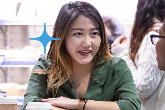 Student talking to other students