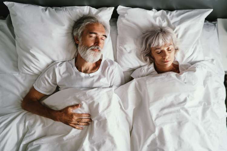Two older adults sleeping