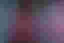 Loading Swirling clouds of pink and blue smoke blend against a dark background, creating a vibrant and dynamic abstract pattern....