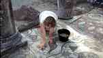 Archaeologist doing a condition survey of Baptistery mosaic