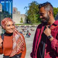 Two students in The Square on the UEA campus
