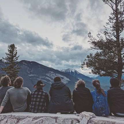 Students on their year abroad sitting on a mountain