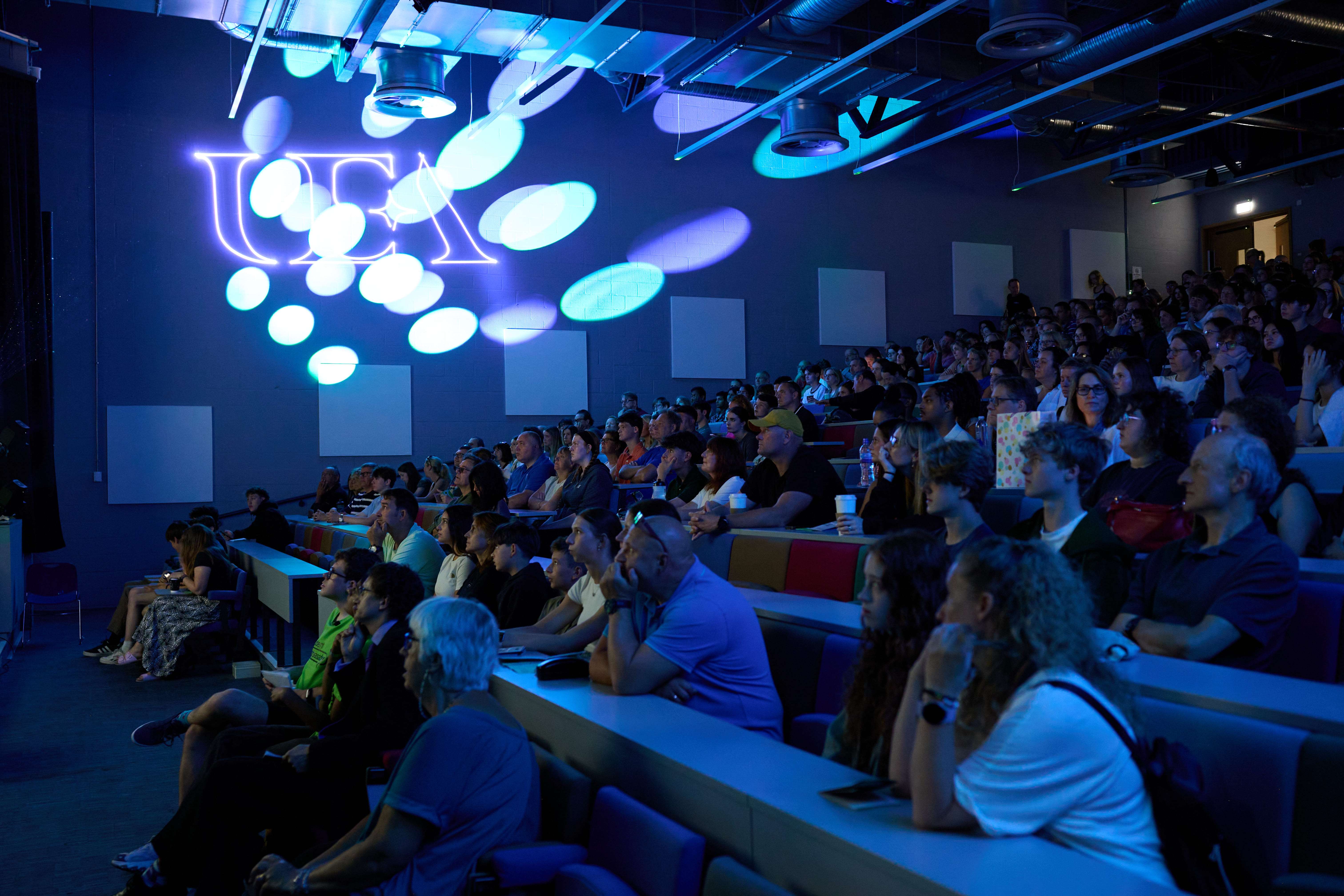 audience watching welcome talk