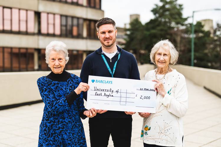 Molly Blackburn (left) and Margaret Doggett (right) present Dr Darrell Green with a cheque to support his research into Childhood, Adolescent and Young Adult Cancer.