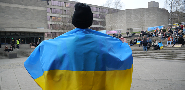 Student with Ukraine flag - 720x350.png