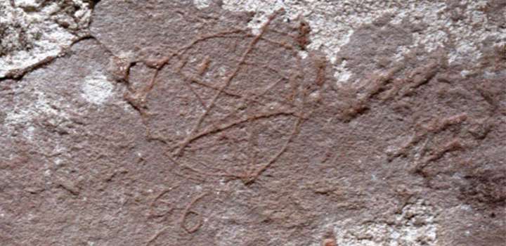 A stone with a pentagram etched into it.