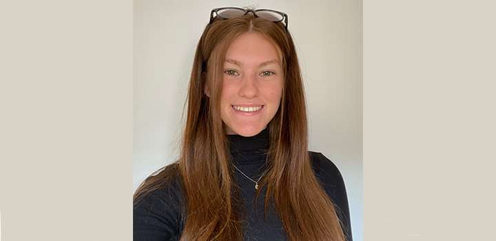 A woman smiling at the camera