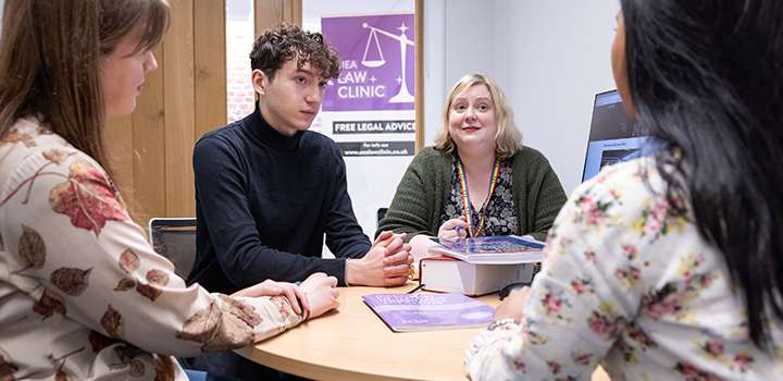 Four people sat around a table.