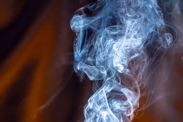 White smoke against an orange background