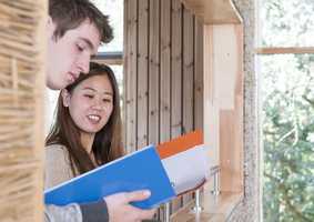 Norwich Business School students reading publications