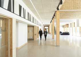 people walking in corridor in Norwich Business School Enterprise Centre building