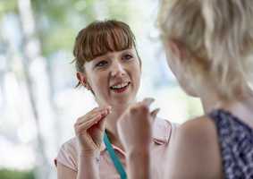 Speech and Language Therapy Students signing using hands