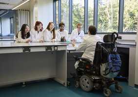 Dr Katherine Deane and students in a lab