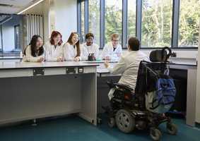 Dr Katherine Deane and students in a lab