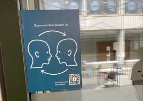Communications access sign on campus door